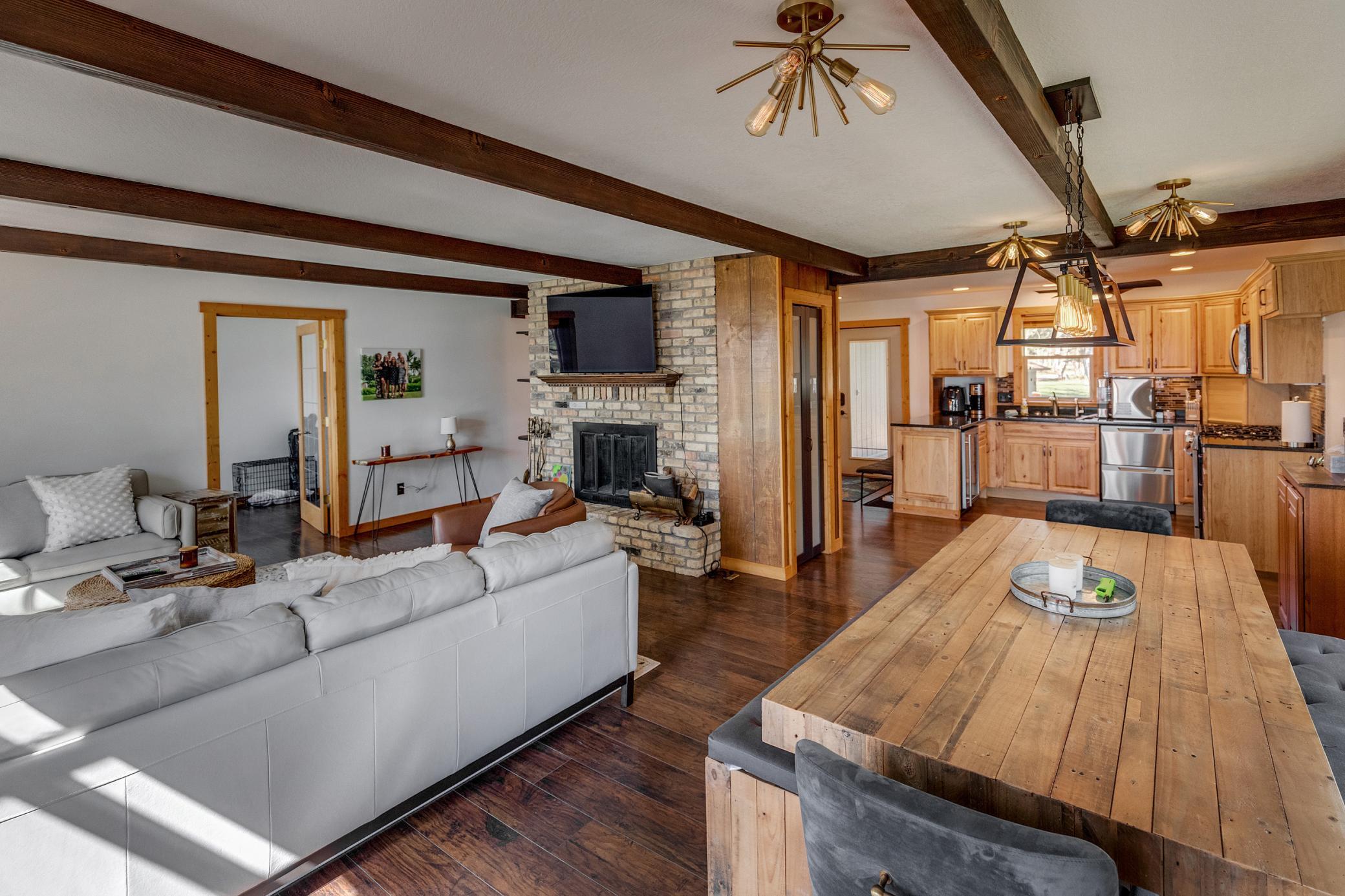 Comfortable living room with cozy wood burning fireplace.