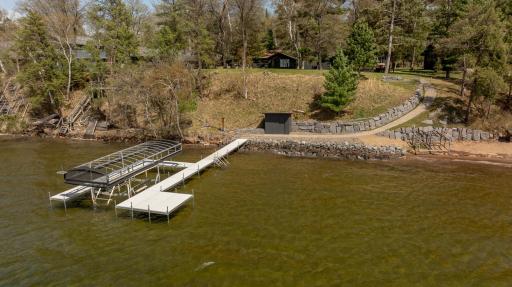 Excellent hard sand bottom for swimming. Recently landscaped walkway, rip rap and boulder wall. Dock included!