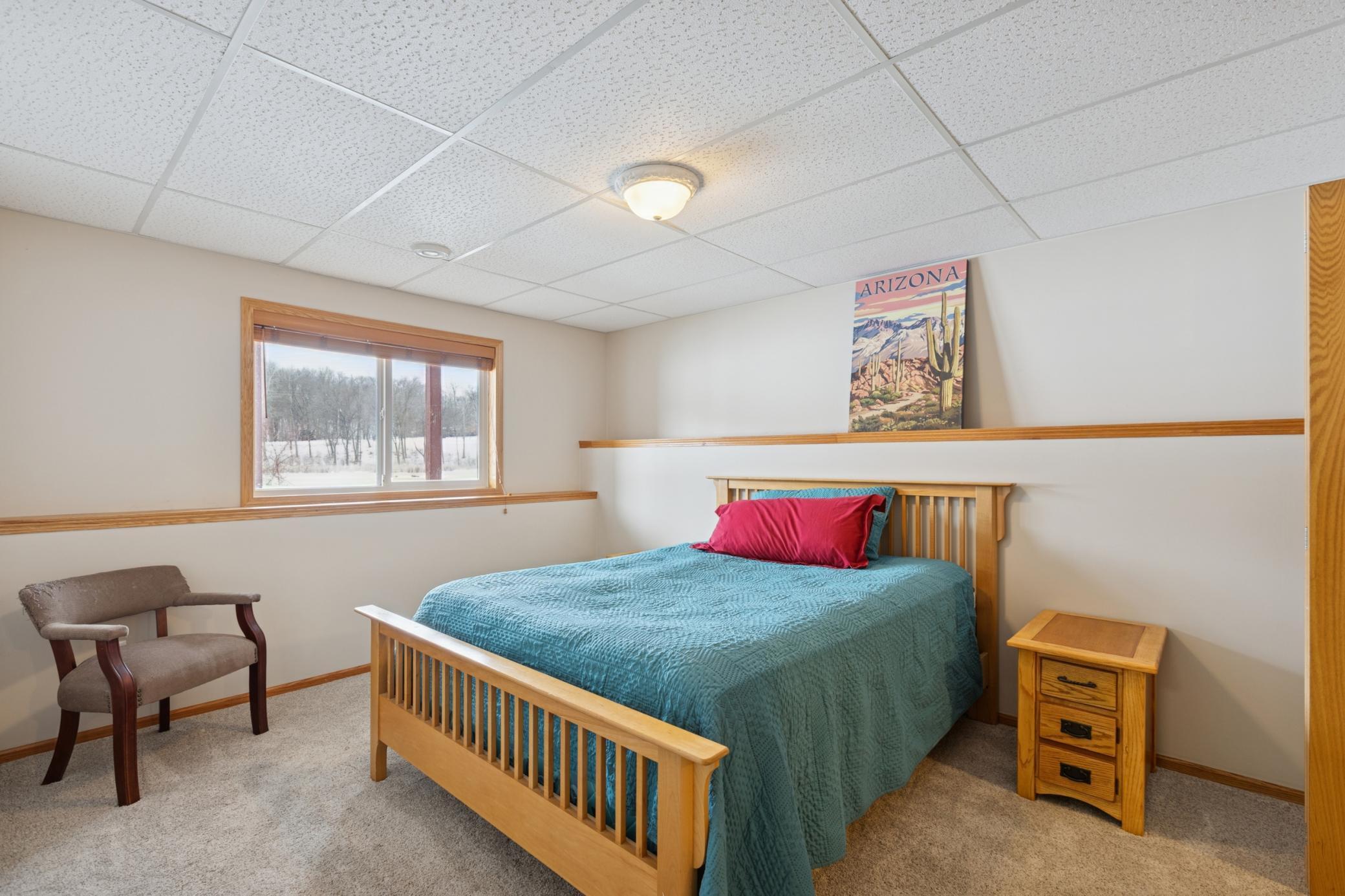 Bedroom 3 on the lower level, overlooks the pond.