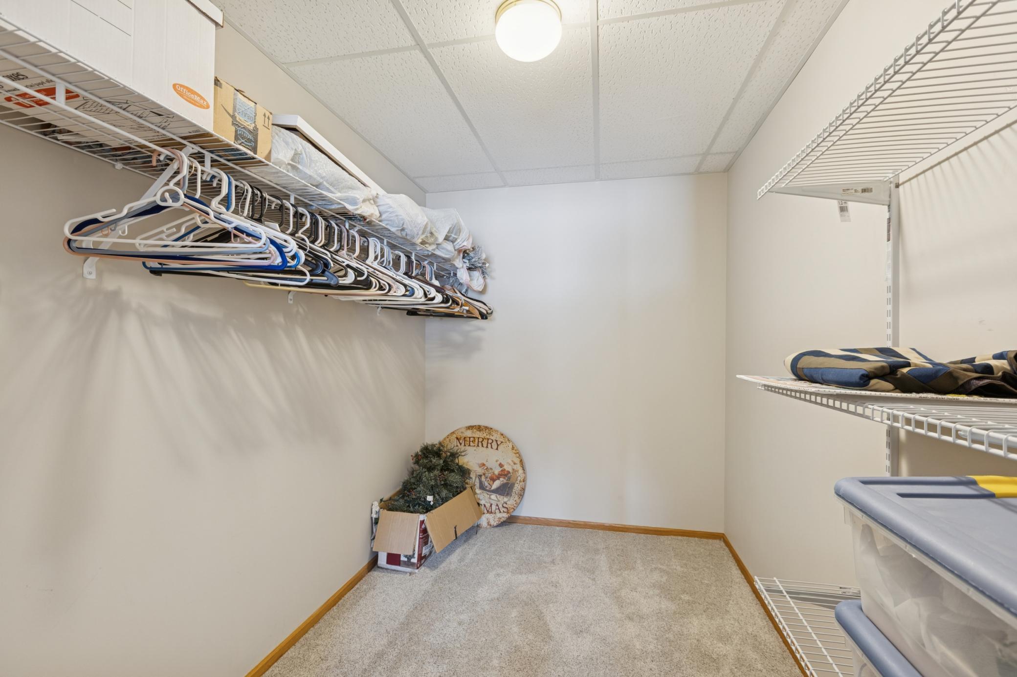 The spacious walk-in closet in the lower-level bedroom measures 7' x 10'.