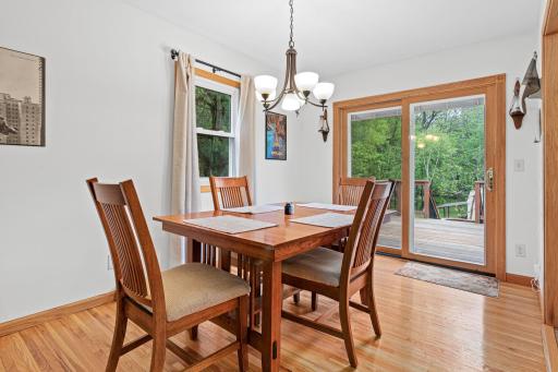 Dining area that has a clear view to the back yard from a great deck. Keep an eye on your garden as you enjoy a meal.
