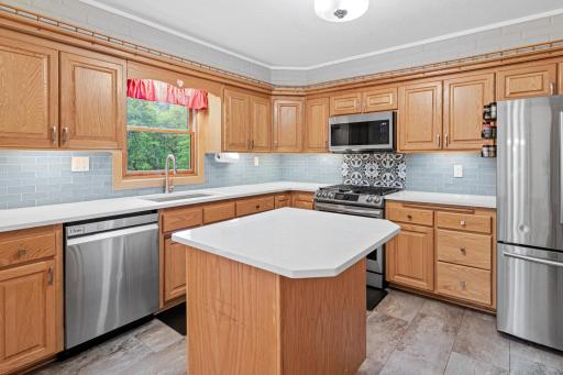 Tile floor kitchen, Stainless Steel Appliances, Granite Counter tops.