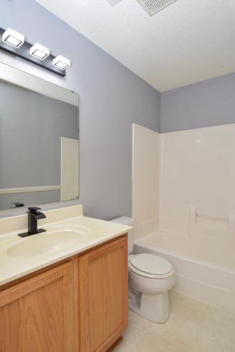 7559 derby main full bath with modern lights.jpg