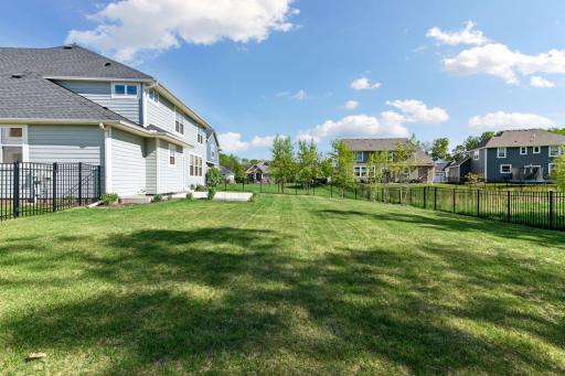 Scenic neighborhood walking and biking paths, including a boardwalk with connection to Lake Ann Park, enhance the outdoor lifestyle. Located less than ten minutes from the Minnesota Landscape Arboretum and charming Downtown Excelsior, this exceptiona