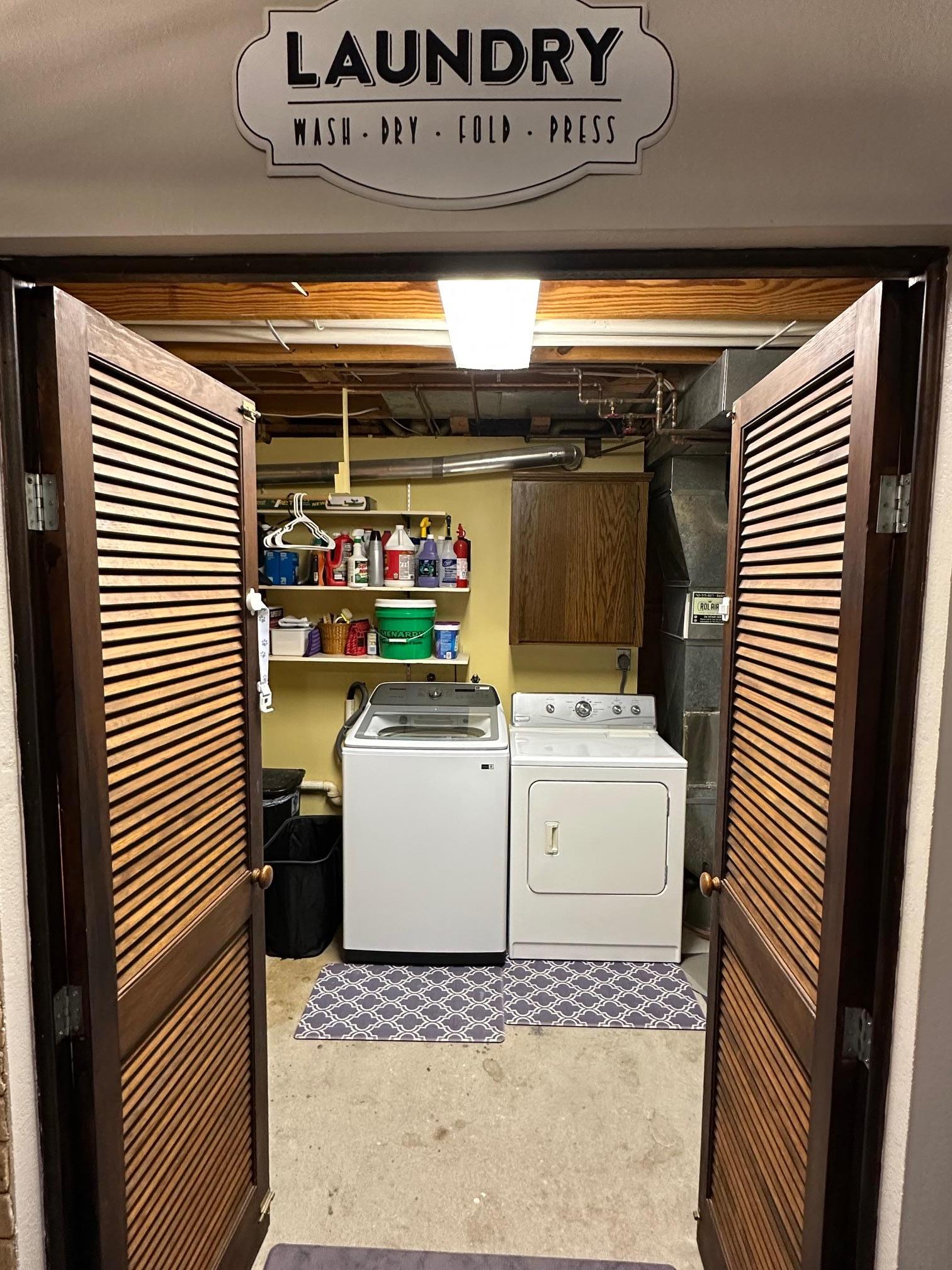 Spacious laundry room with folding counter (not pictured) and storage