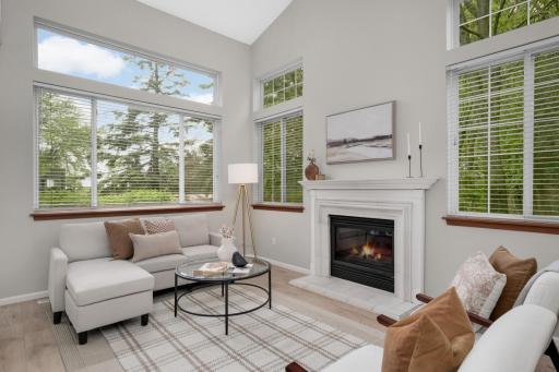 Gas fireplace surrounded by large windows