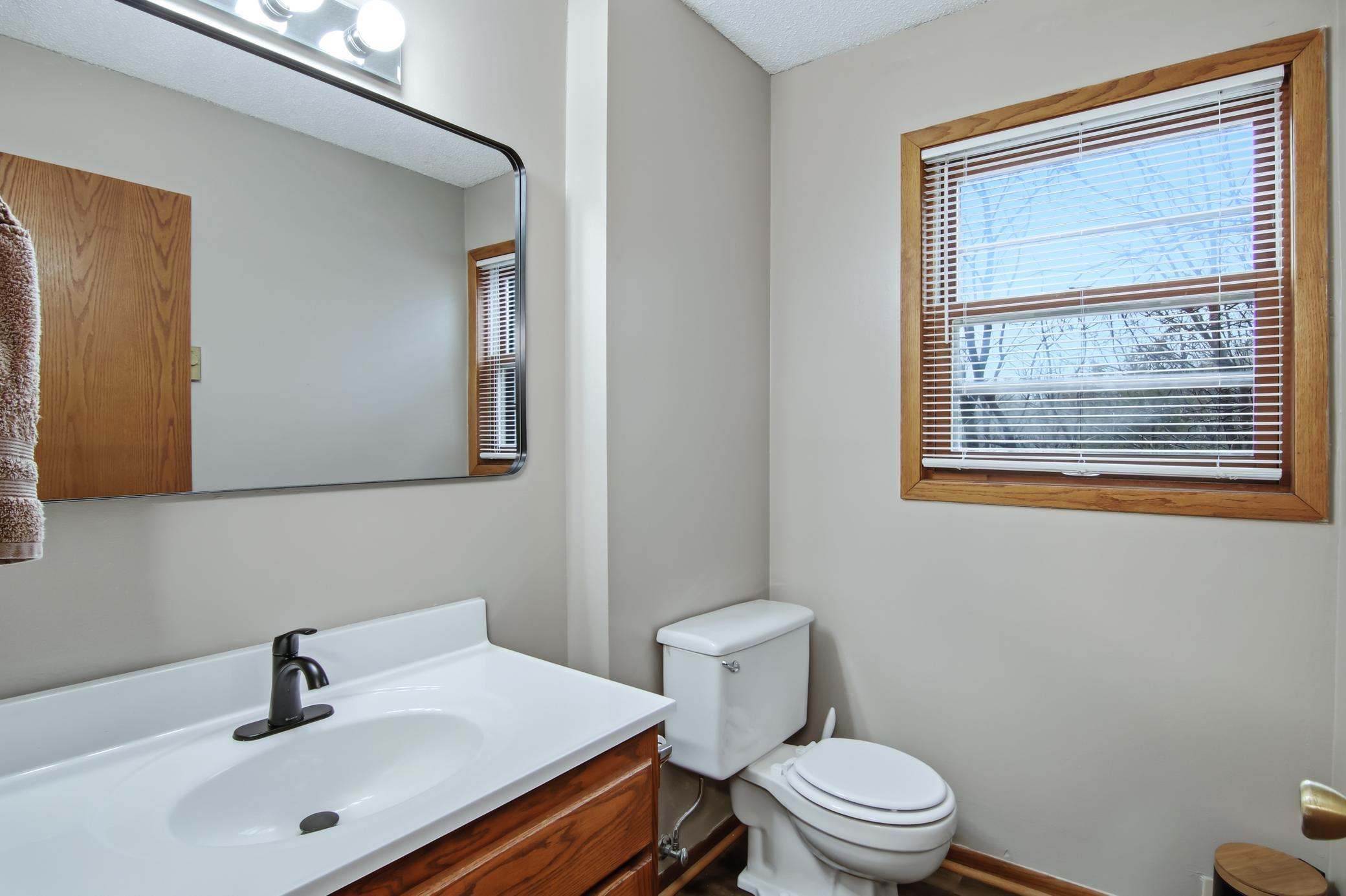 Main floor half bath with a new sink/counter/faucet.