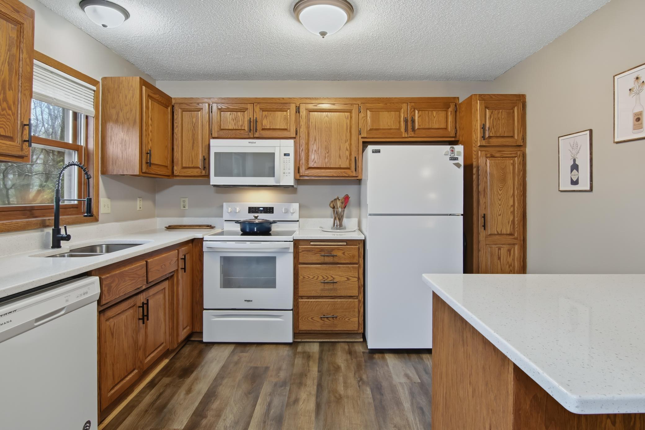 A super functional and attractively updated kitchen with brand new quartz counter tops!