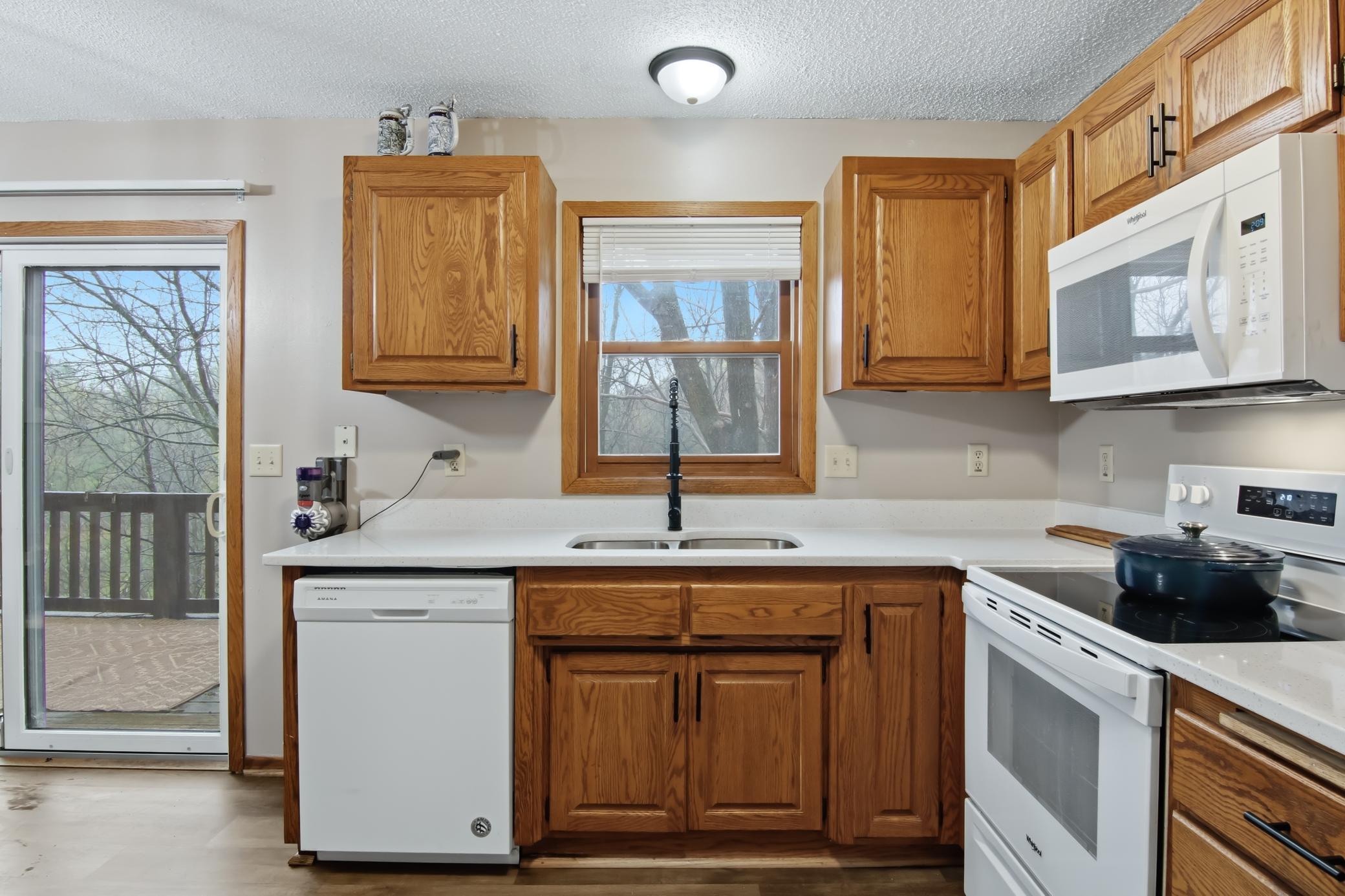 The stove, refrigerator, and microwave are just one year old.