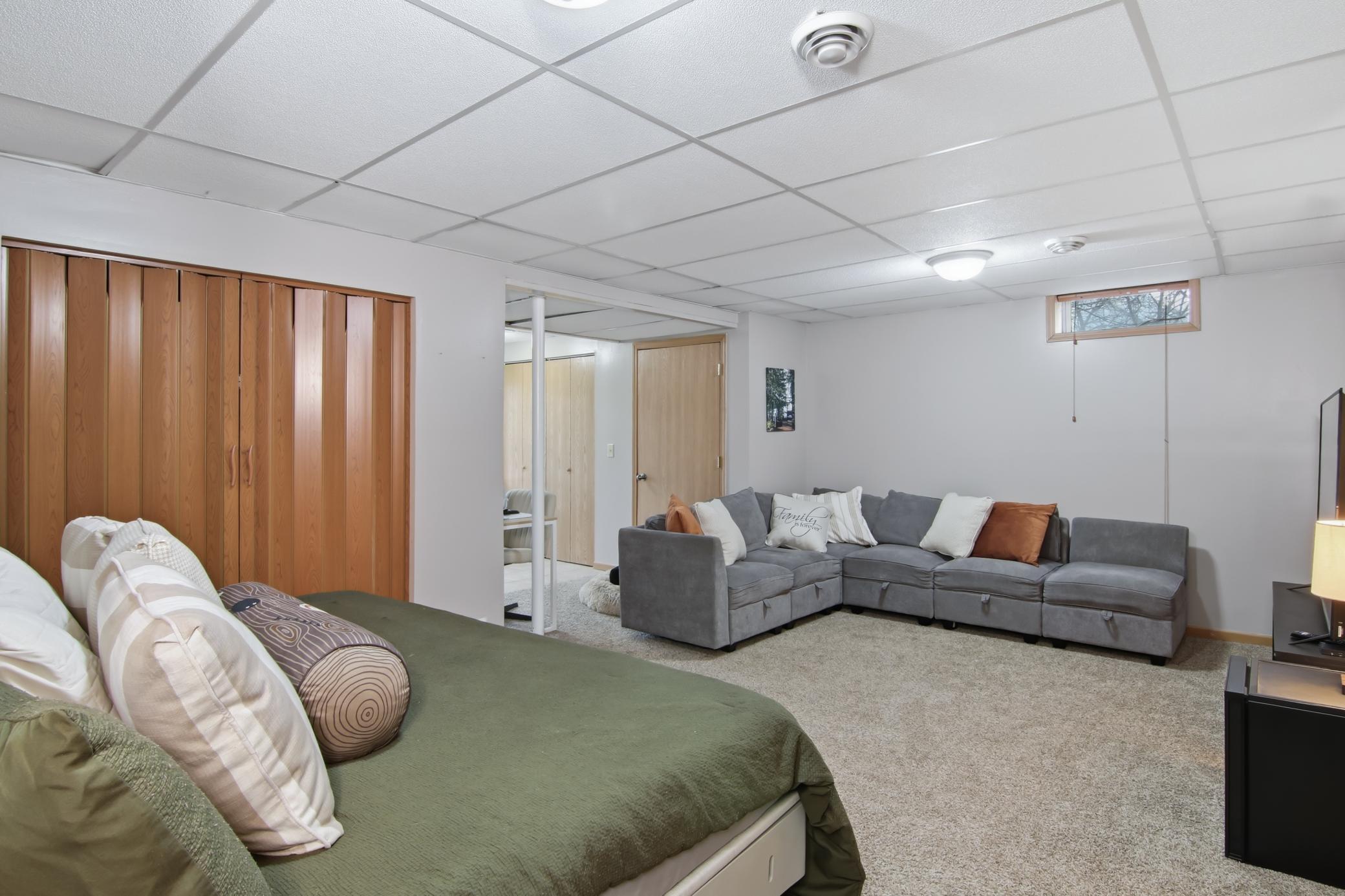 The lower level is finished and could provide you with a third bedroom.