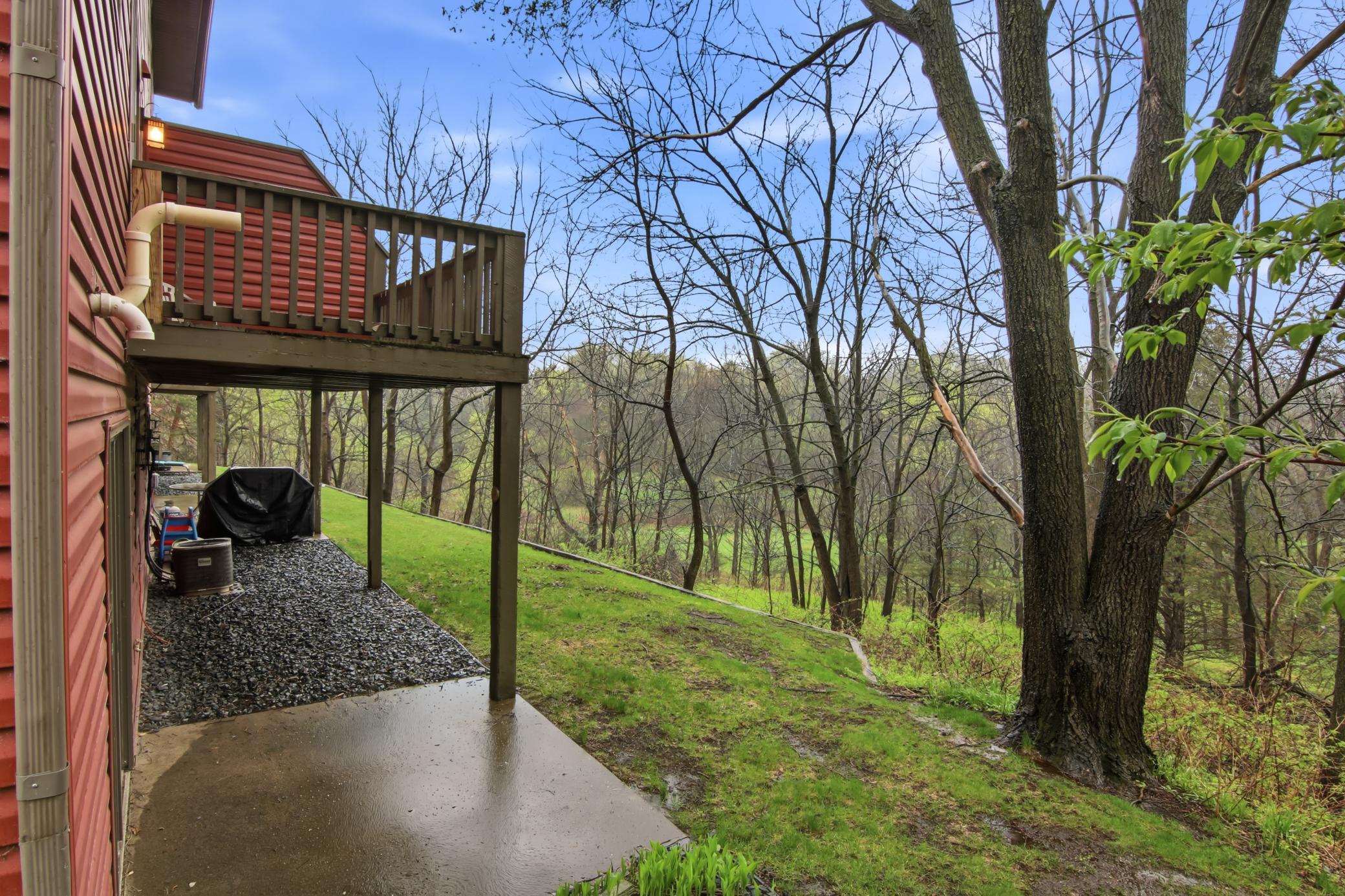 A beautiful setting with woods in the backyard.