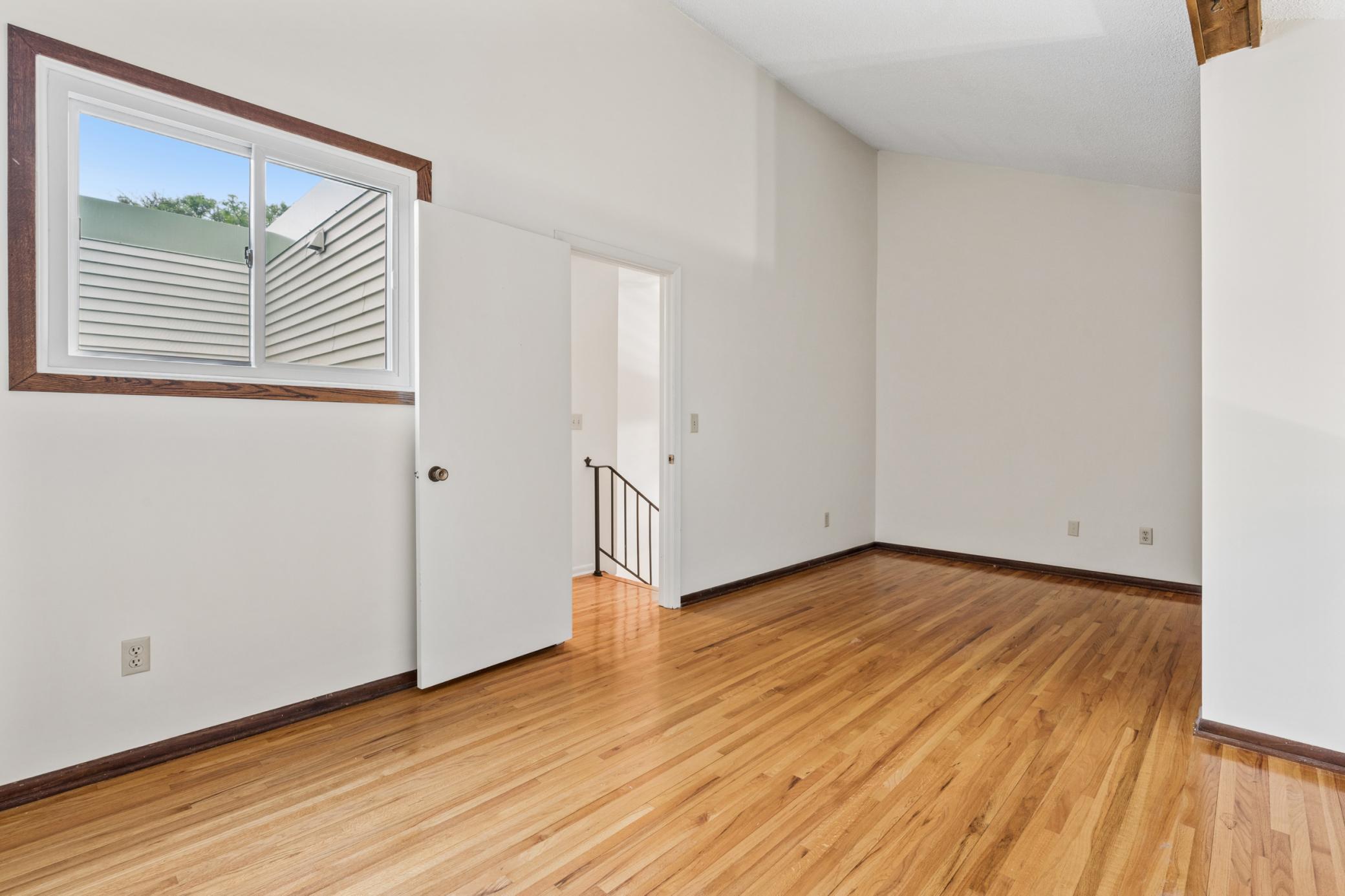 Upstairs, a versatile loft is ideal for a home office, playroom, or additional living area.