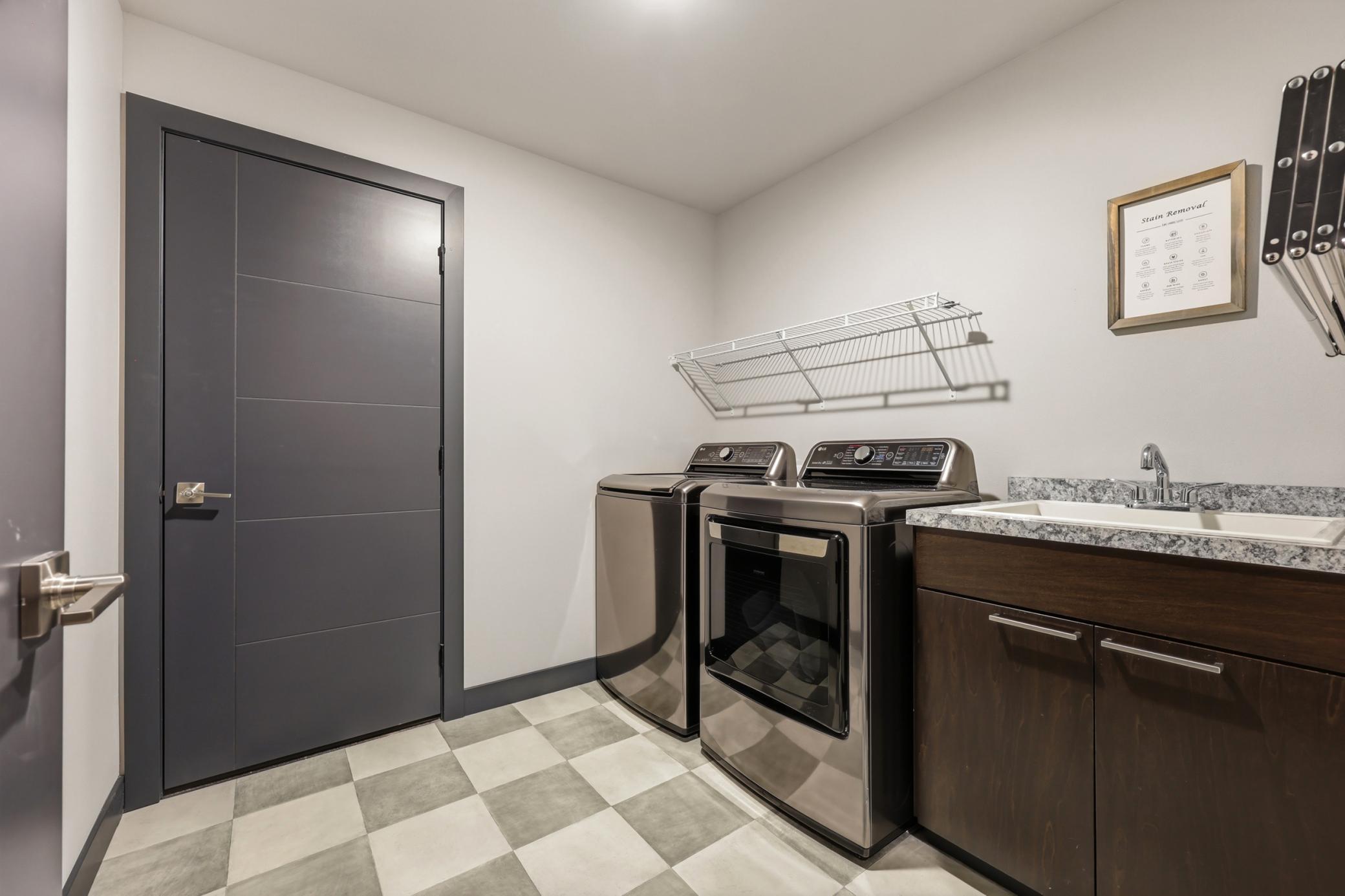 laundry room with sink, w/d included