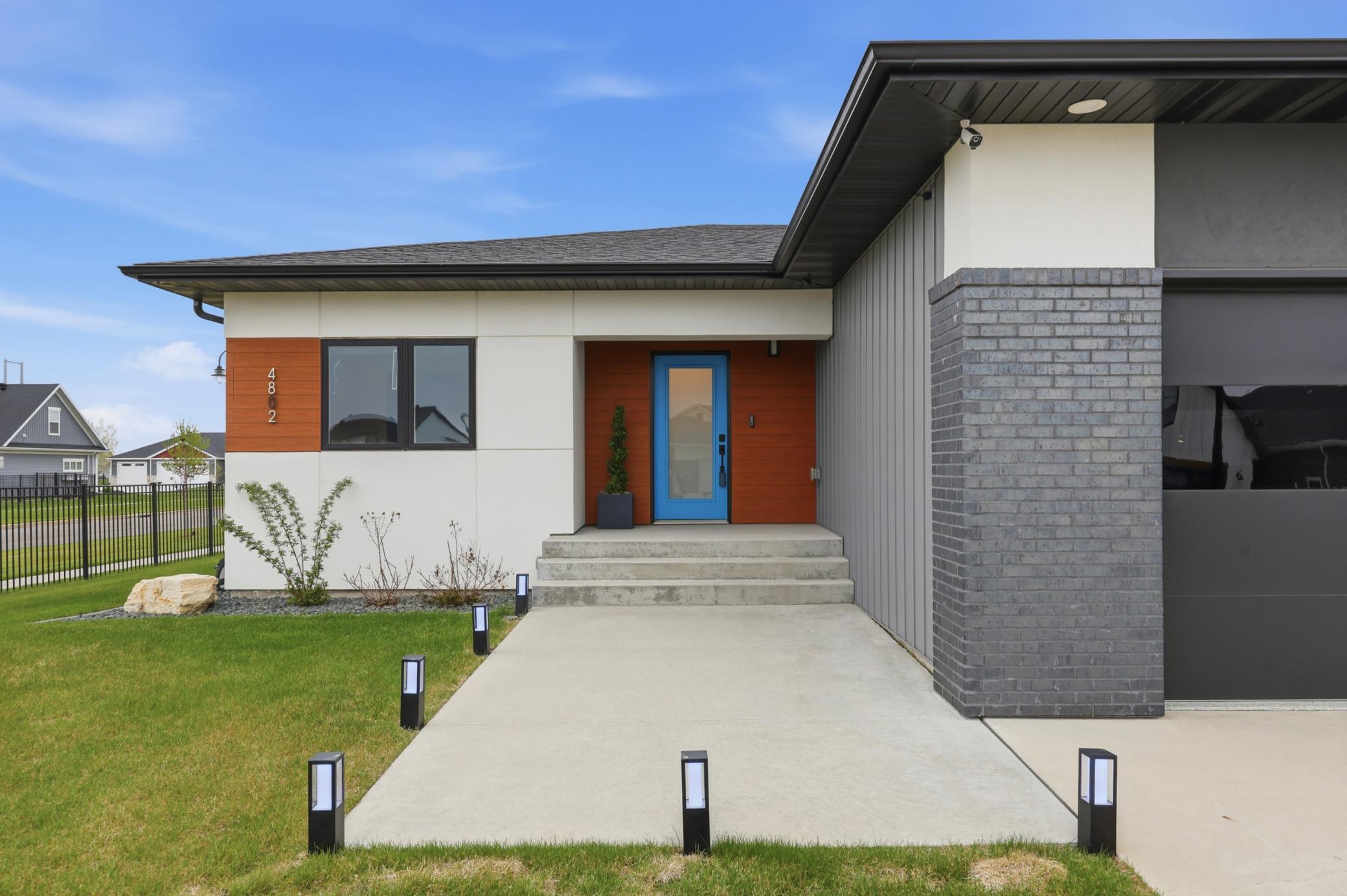 front of home/foyer with phone controlled landscaping lights