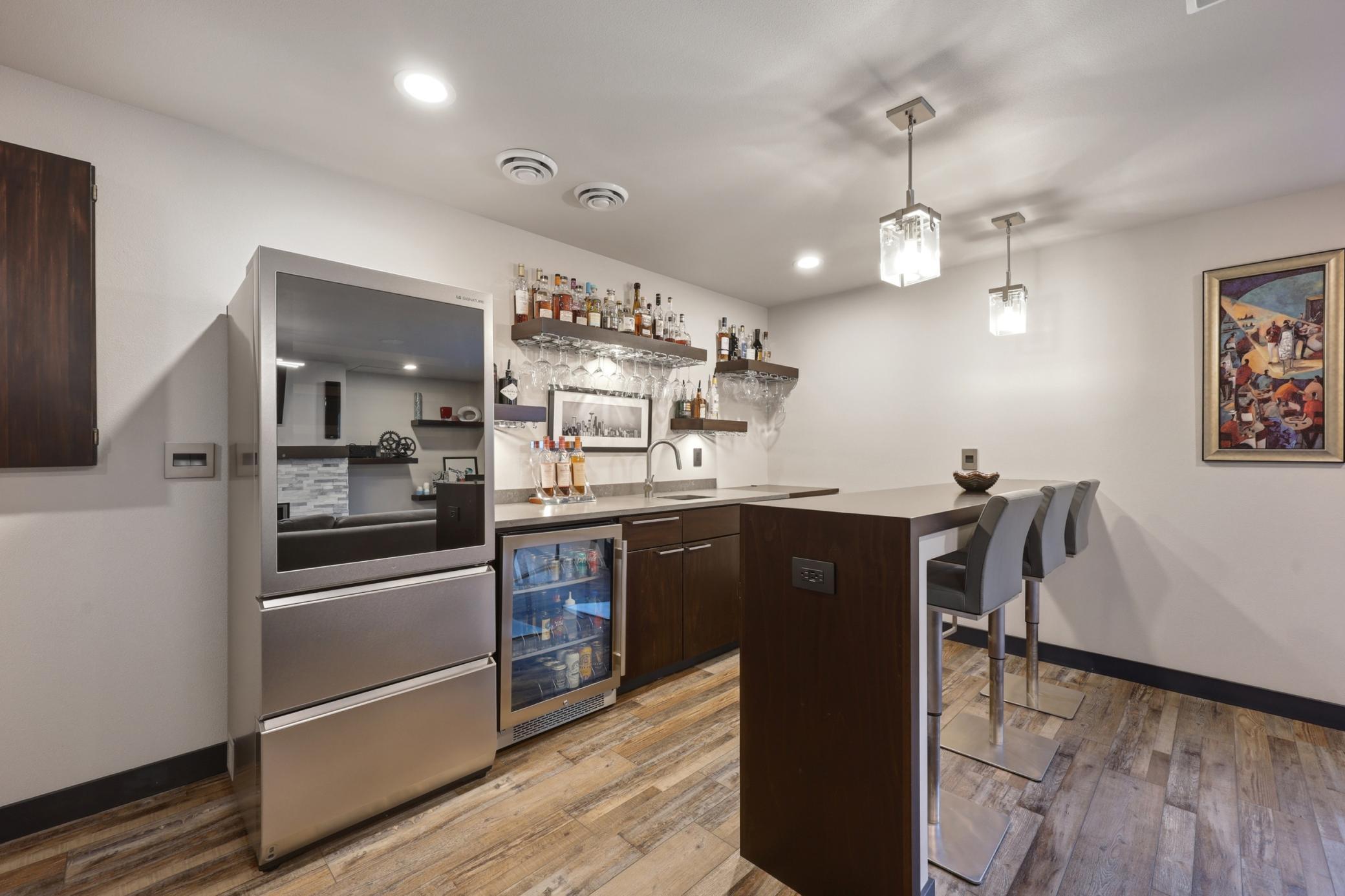 wet bar with wine fridge/freezer with toe kick to open/close
