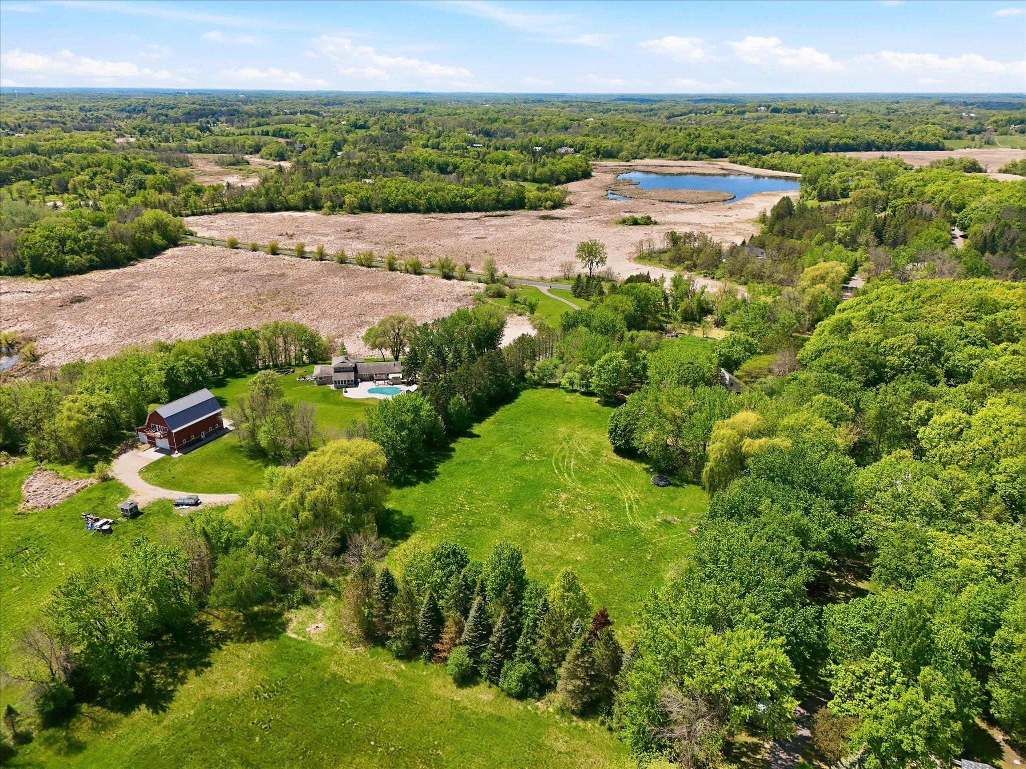 Absolutely stunning nearly 7 acre property for your new private home site treelined private drive to a piece of heaven. Existing home on site already approved for ADU/guest house.