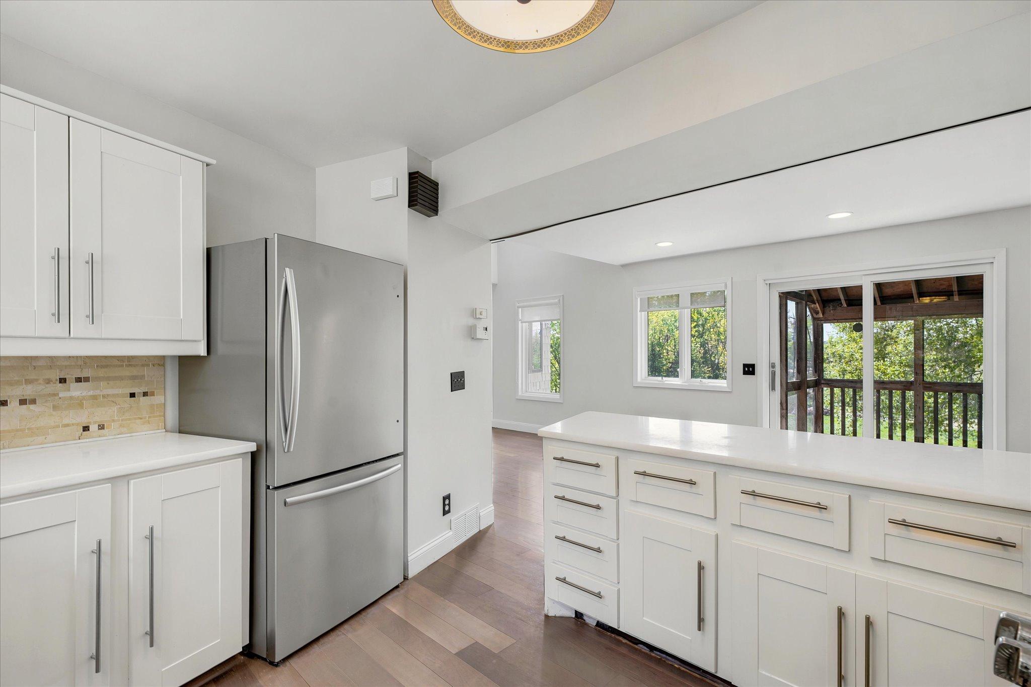 open kitchen with amazing views to the outdoors and nature *Keep home as primary, or Approved for ADU/guest house - modifications to complete with your builder. Survey available with new placement for your dream home!
