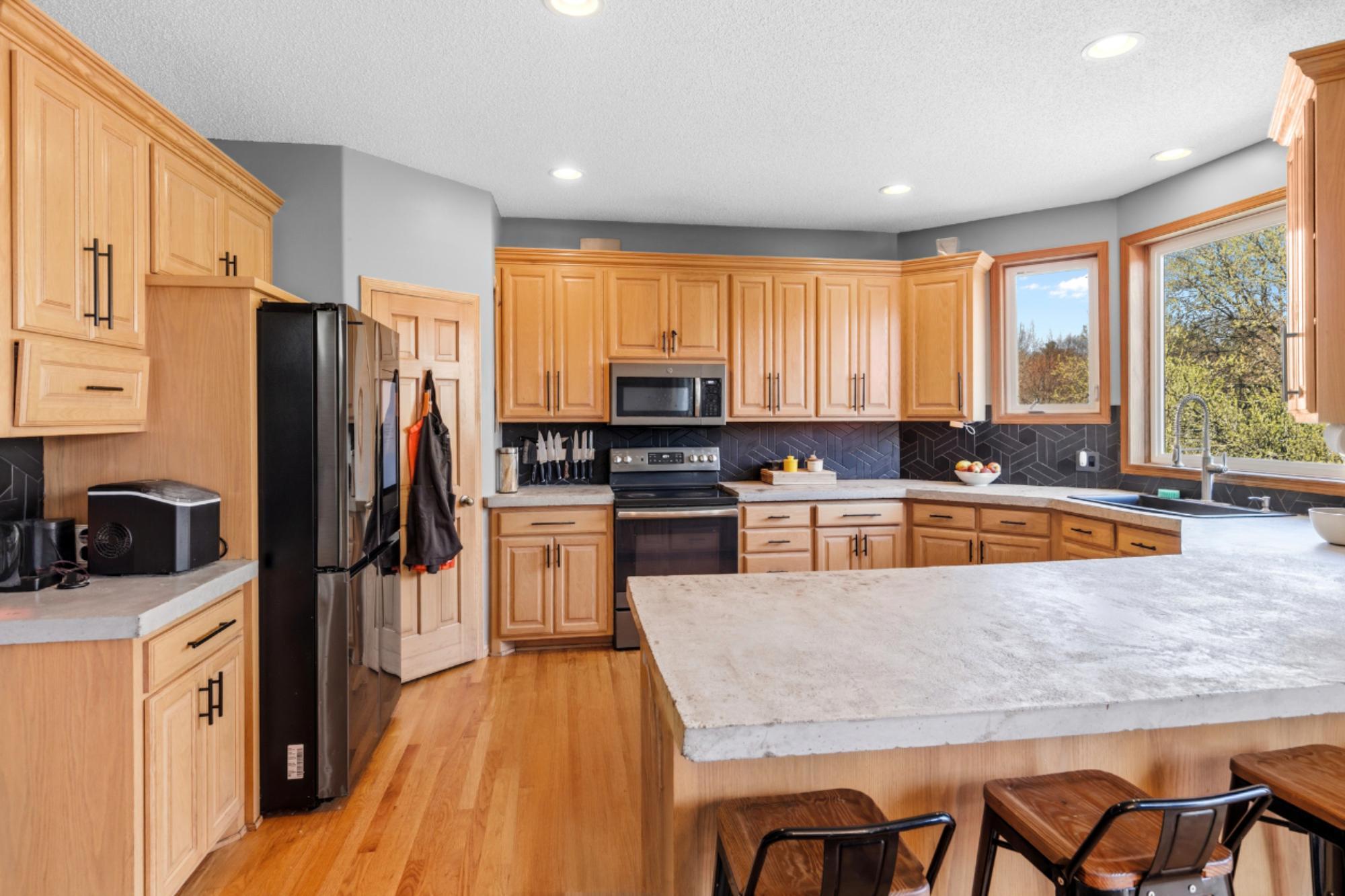 Great additional seating at the breakfast counter. There's wonderful storage in the Pantry. The Kitchen offers an abundance of cabinet and counter space as well.