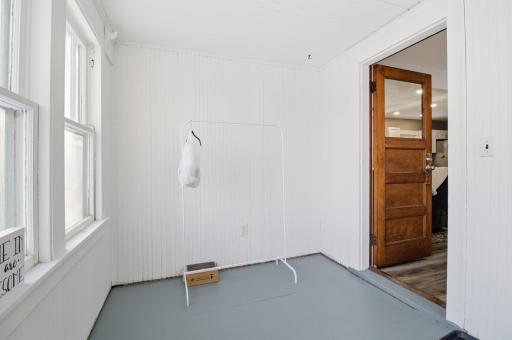 Spacious and light-filled front porch welcomes you in.