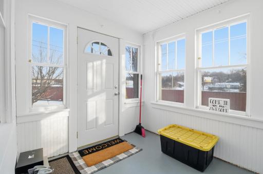 Spacious and light-filled front porch welcomes you in.
