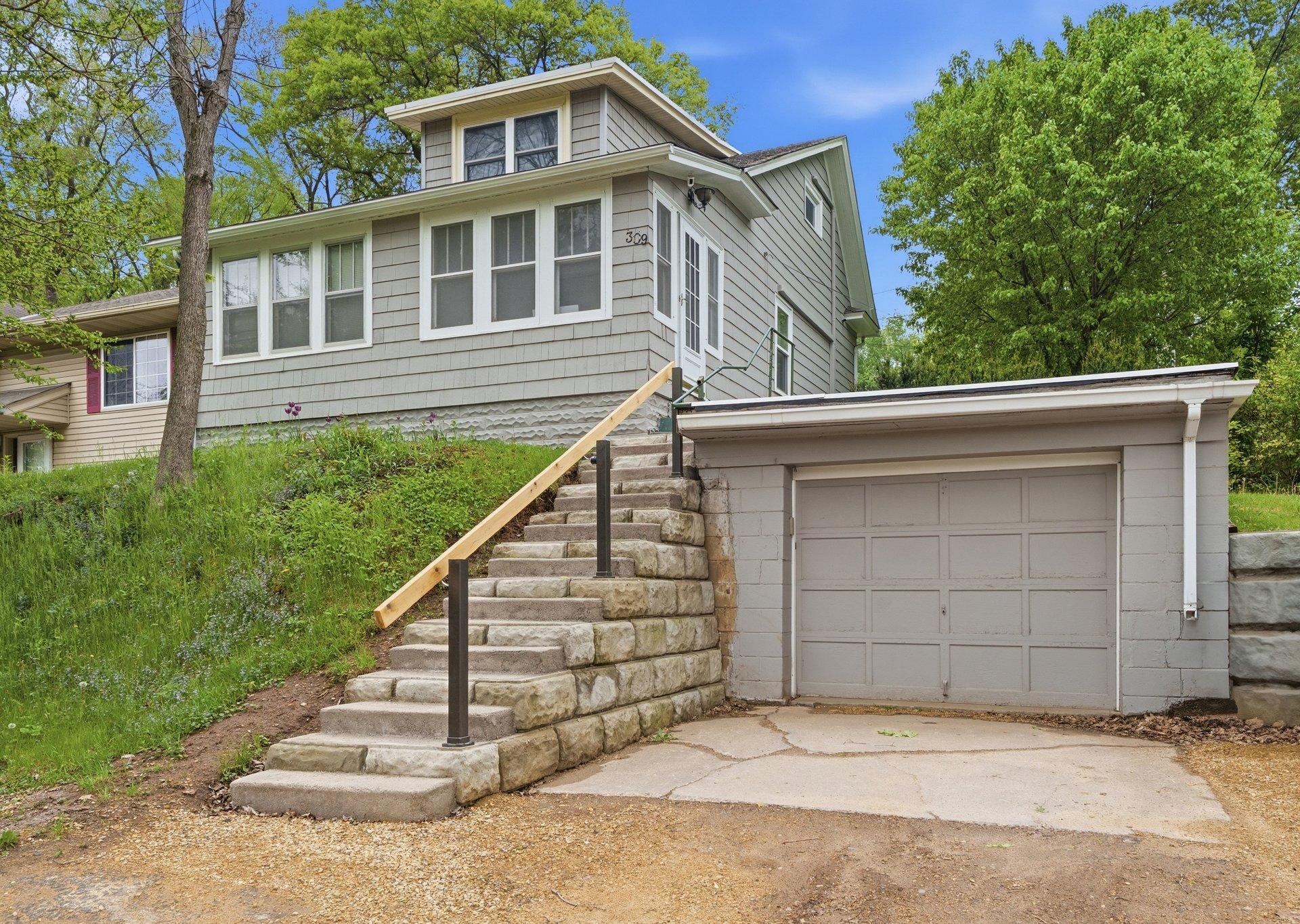 A gorgeous new paint job and new windows instantly boosted this home's curb appeal!