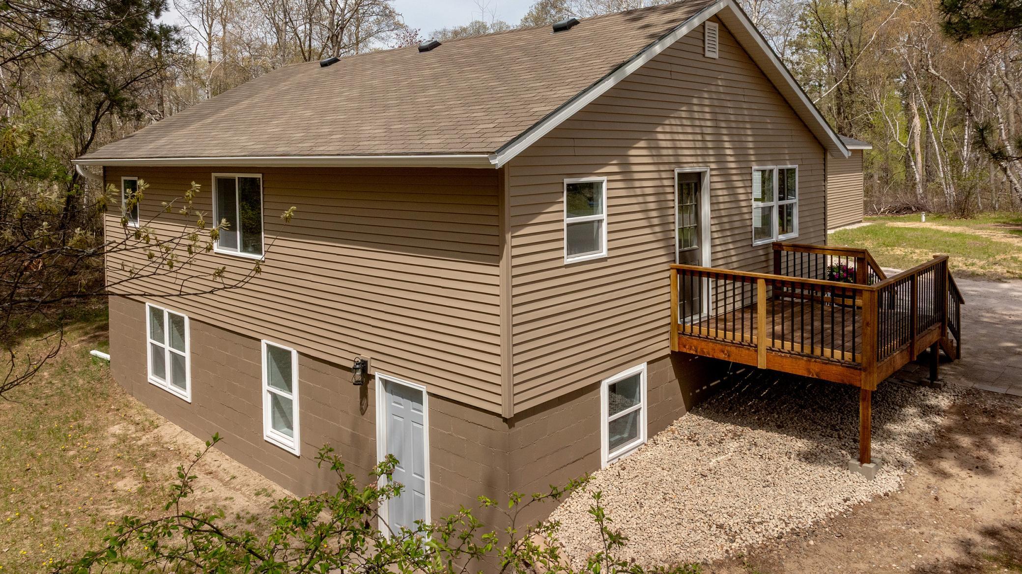 Back of house with walkout