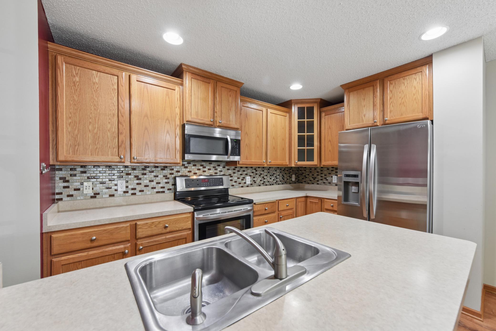2489 Dawes Place #D - Stainless steel appliances and tile backsplash