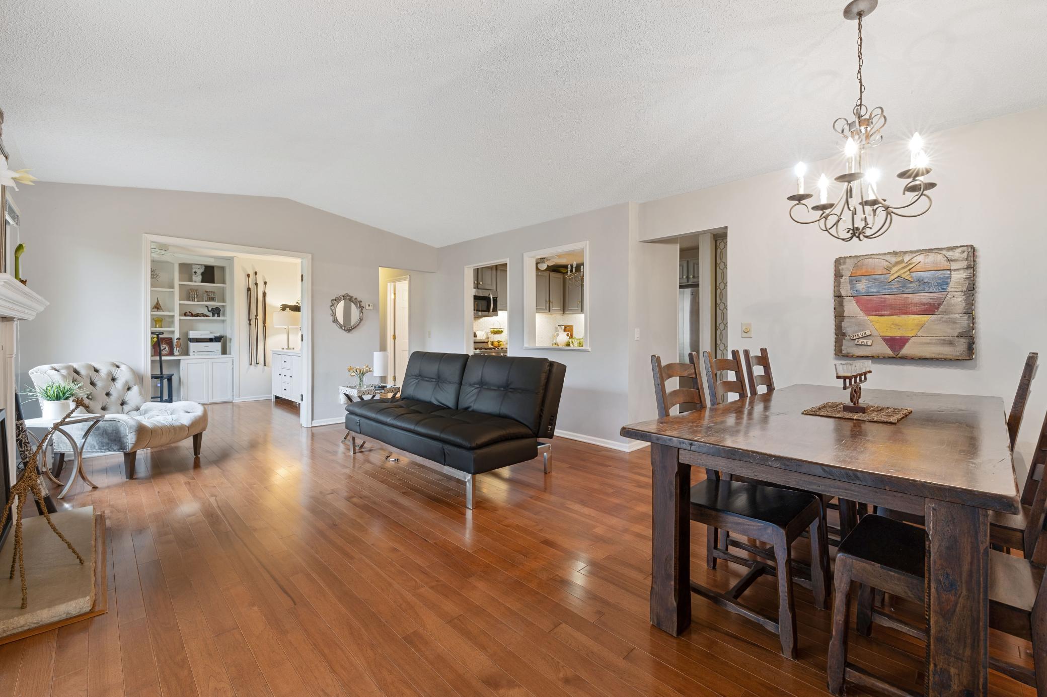 Vaulted living room with hardwood floors.
