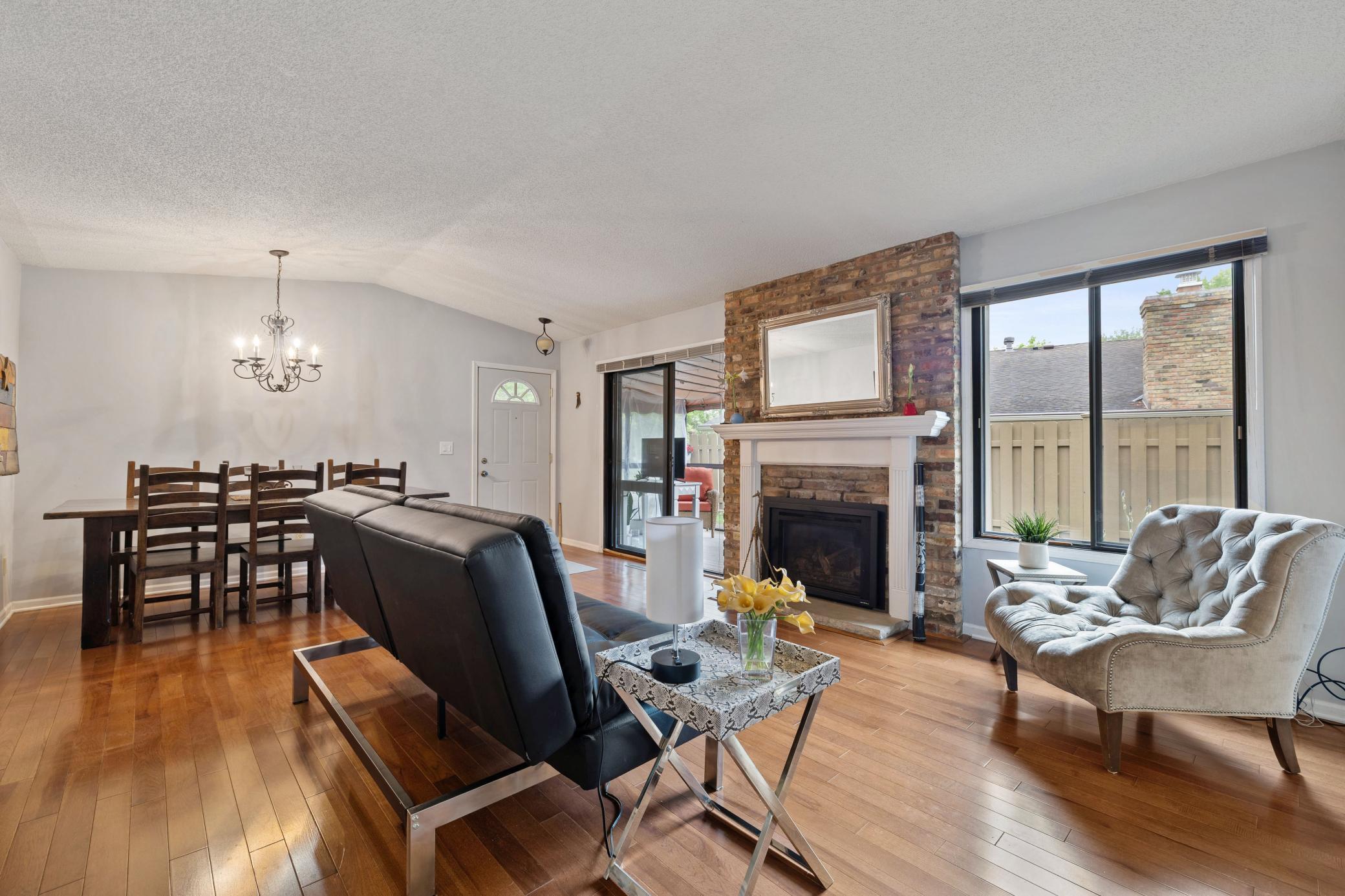 Living room, Dining room with fireplace and access to screened porch