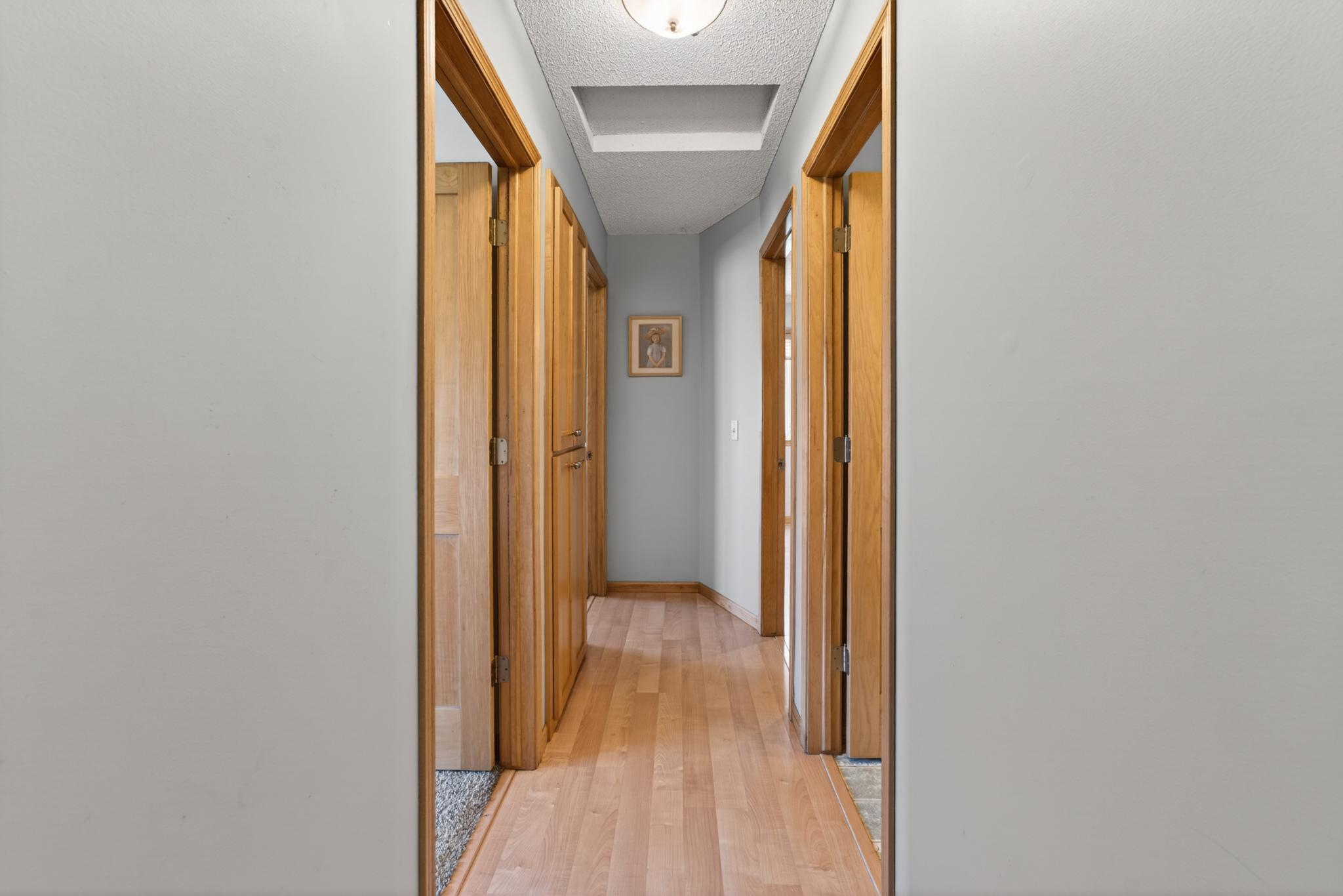 Upper level hallway to 3 bedrooms and full bath