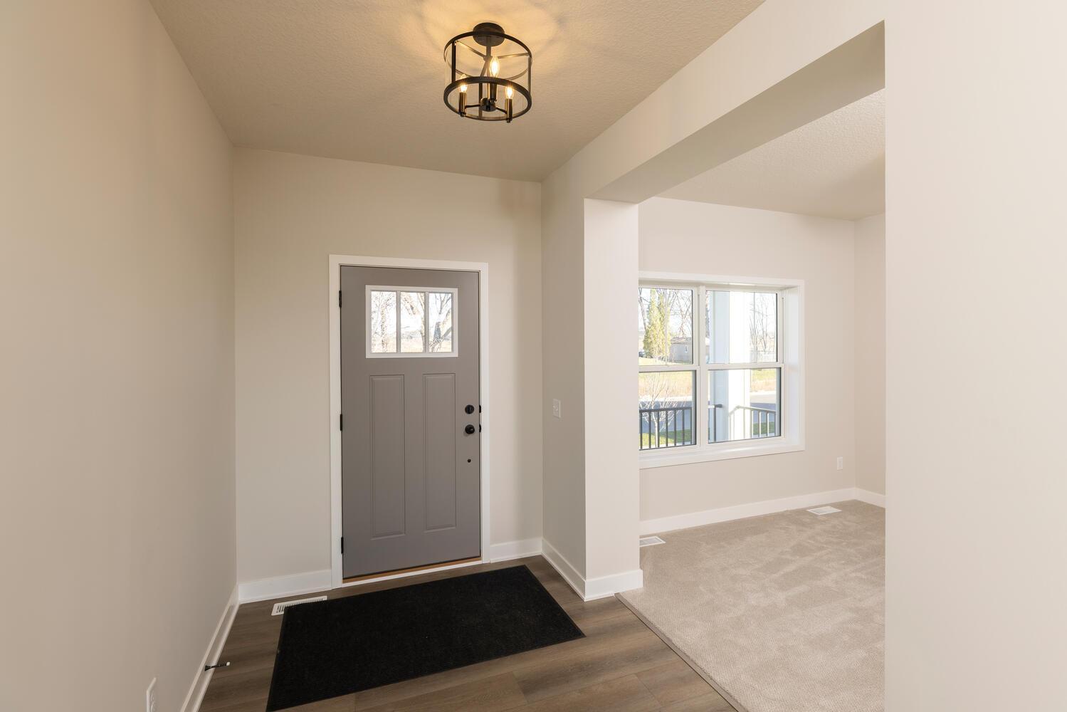 A well defined entrance with spacious front flex room!