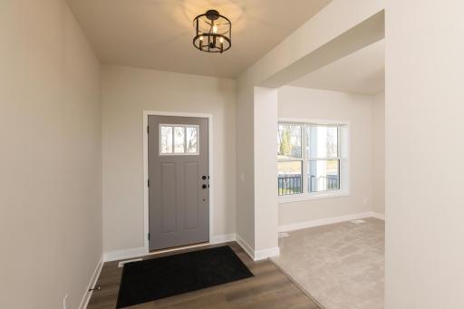 A well defined entrance with spacious front flex room!