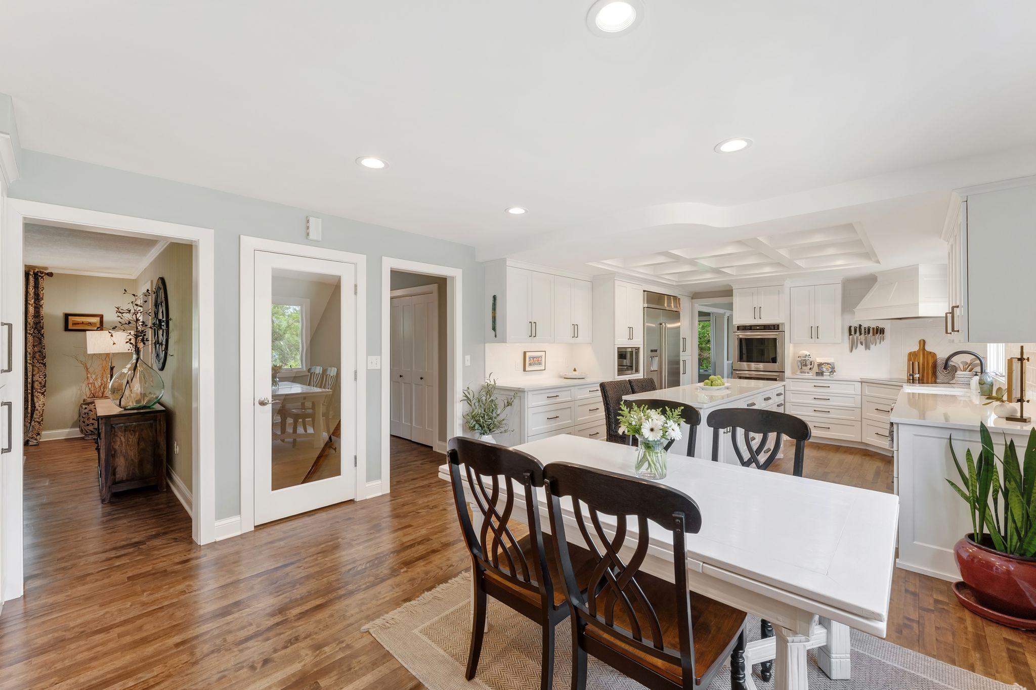 From the beverage hub you can see the den to your left and the glass door to the lower level