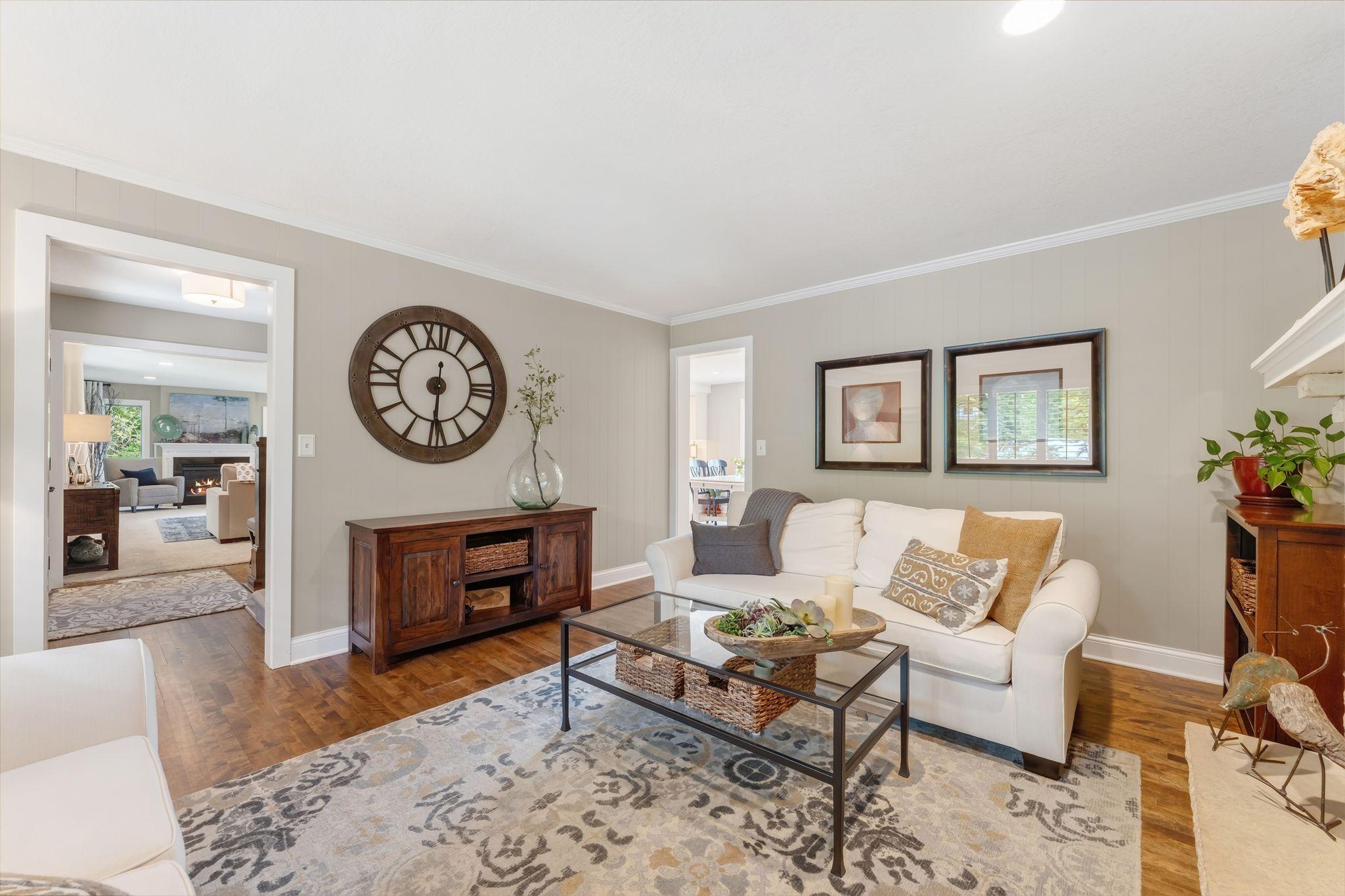 You can see the foyer and the kitchen from this main floor den.