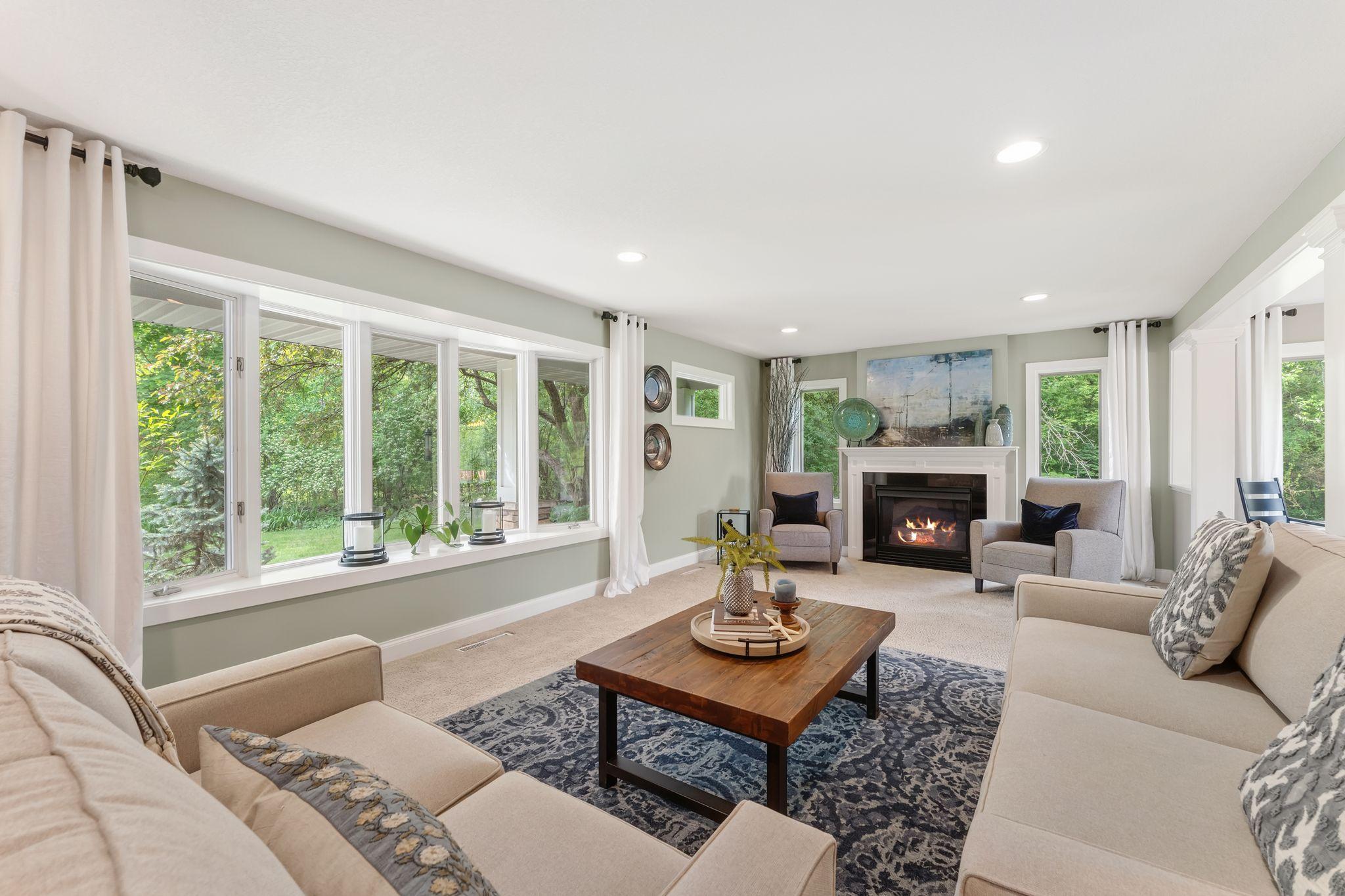 The front bay window offers nature views in all seasons
