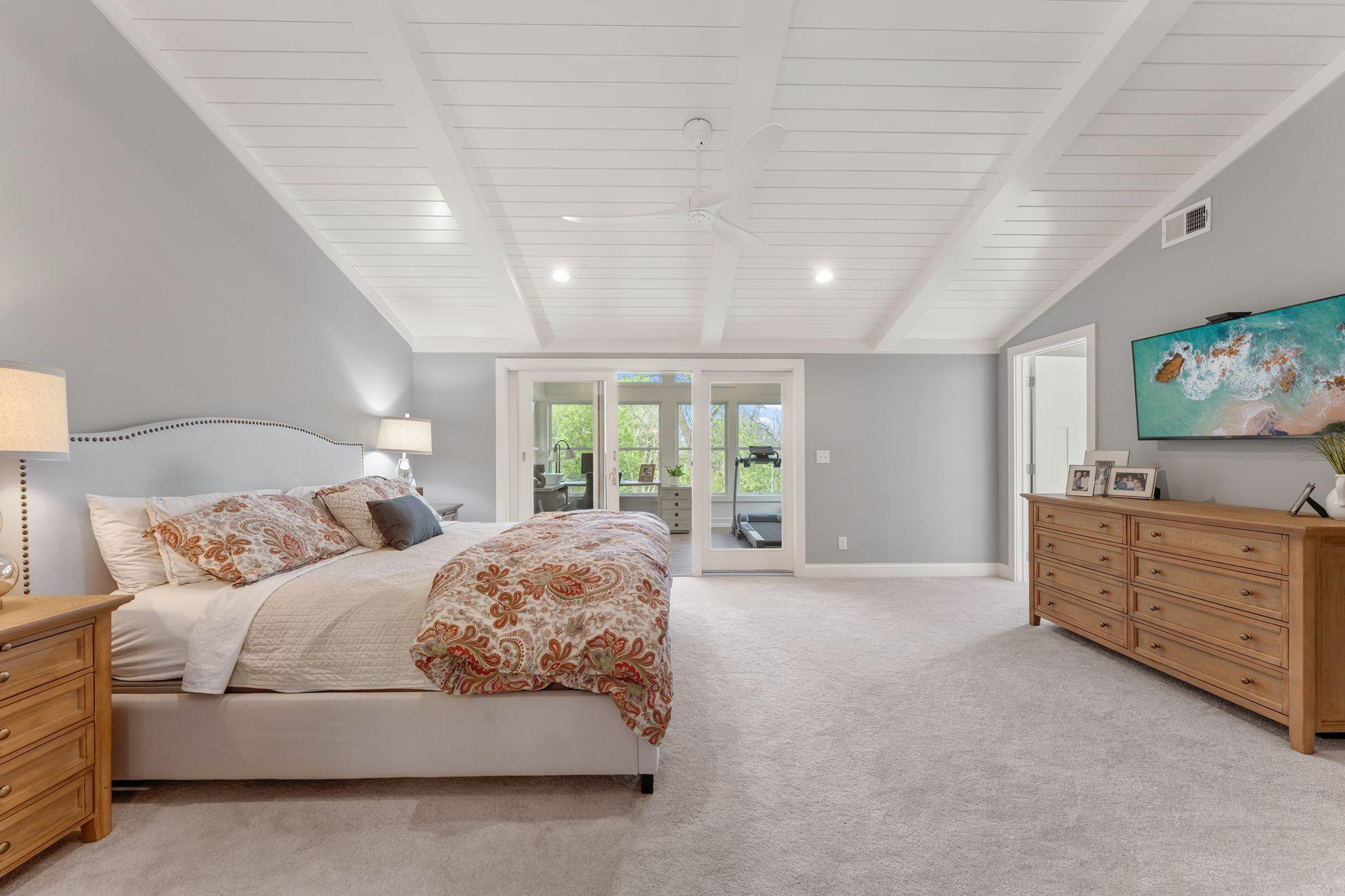 custom wood beamed ceilings, a private tree top sunroom/office, a spa bath retreat and a closet right out of Hollywood