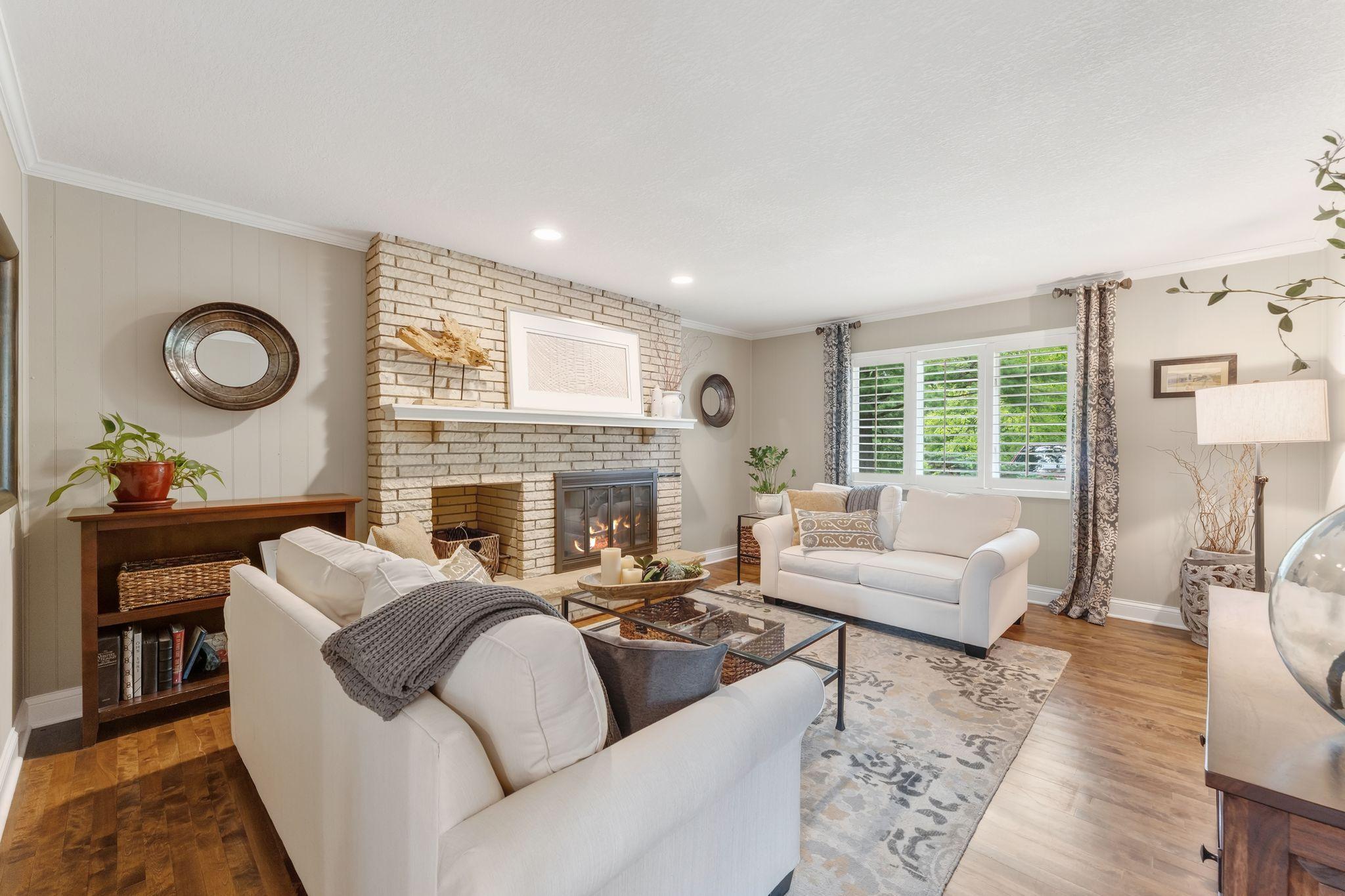 This coy den with its brick wood burning /gas log fireplace and warm hardwood floors offer the best place to unwind