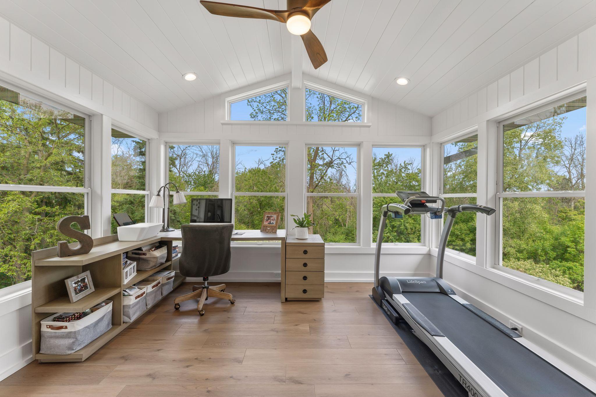 And this four season vaulted sunroom completes the primary suite with a quiet place to work, do yoga, and simply enjoy the views.