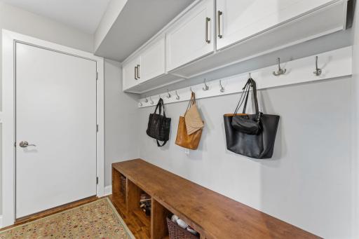 The mud room off the garage offers ample storage
