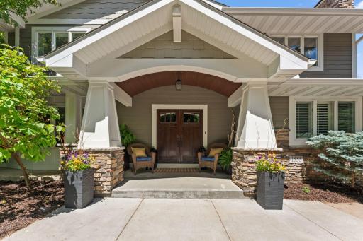 Completely updated exterior featuring James Hardie Siding and a welcoming covered front porch.