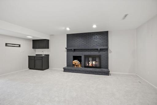 This room has a moody vibe with a wet bar