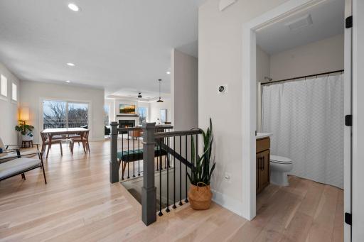 The foyer opens into a bright, open-concept living area with easy access to the downstairs level
