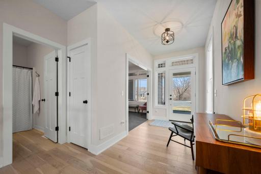 Front entry foyer with a bathroom right outside the office