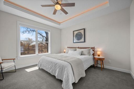 Primary bedroom offers an ensuite bath and large walk-in closet