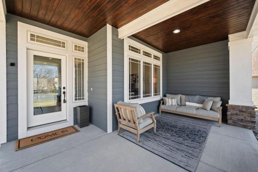 Relax on the inviting front porchâperfectly sheltered for enjoying the outdoors, rain or shine.
