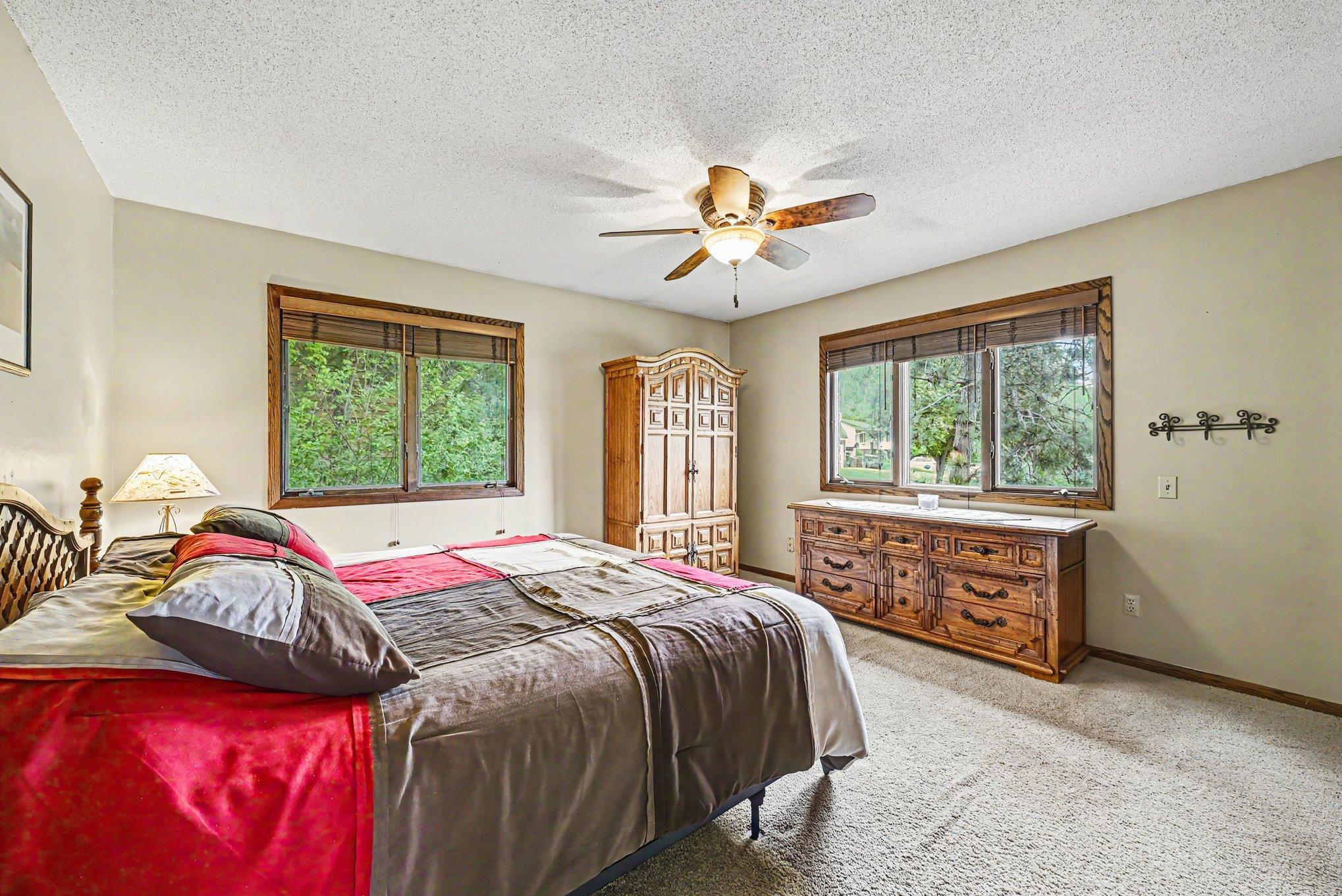 Upper level primary bedroom with two closets
