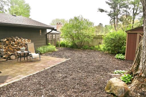 Ample space on the side of the patio. The gate in the back opens to the driveway