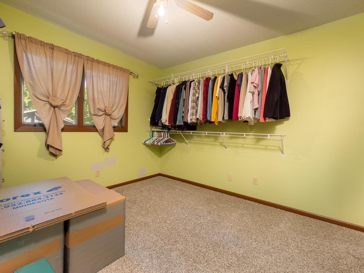 Main level bedroom 2 has been used as a walk-in closet. Easily returned to use as a bedroom.