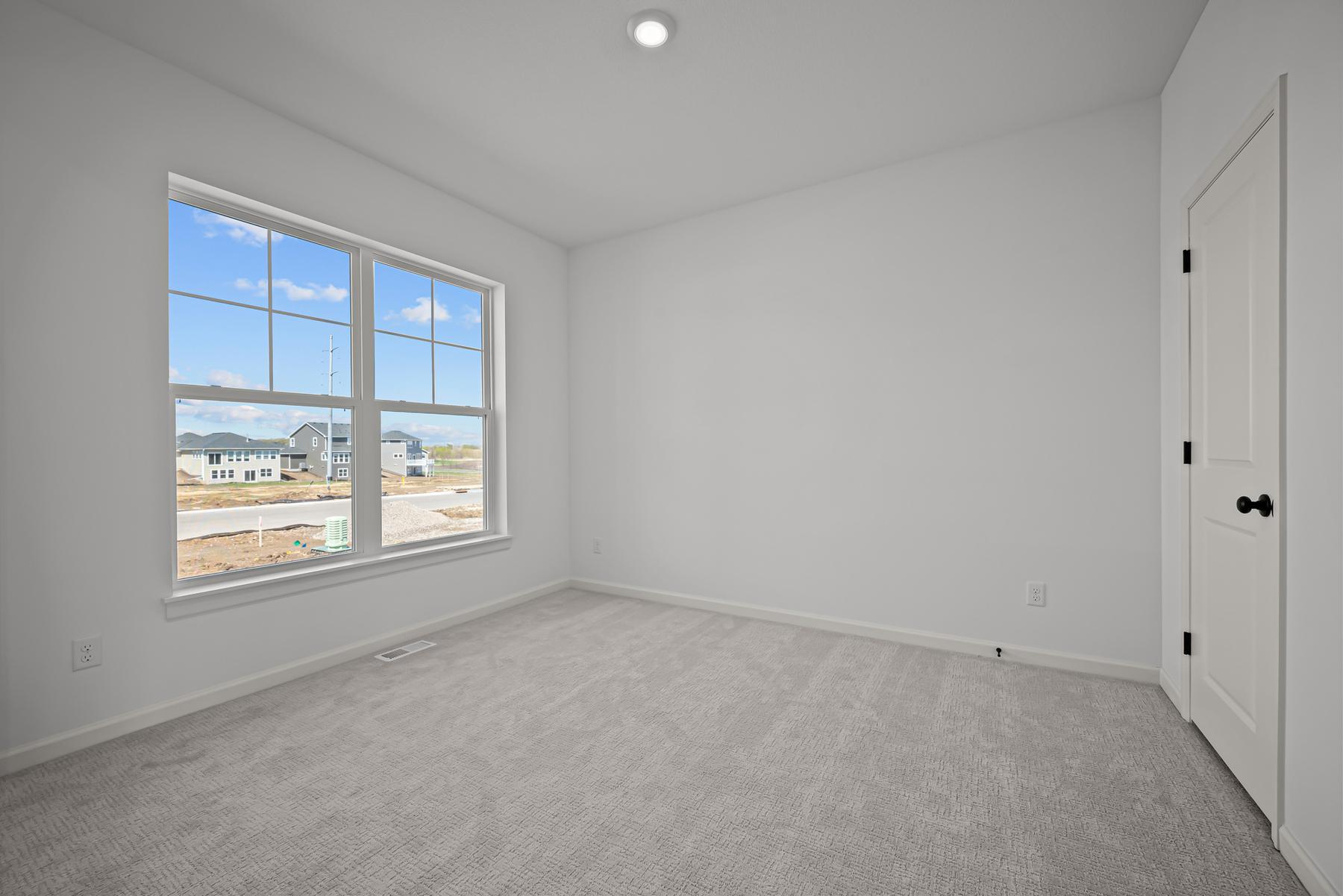 Private primary suite in the McBee plan offering comfort and separation. Images are from a similar home, interior selections may differ
