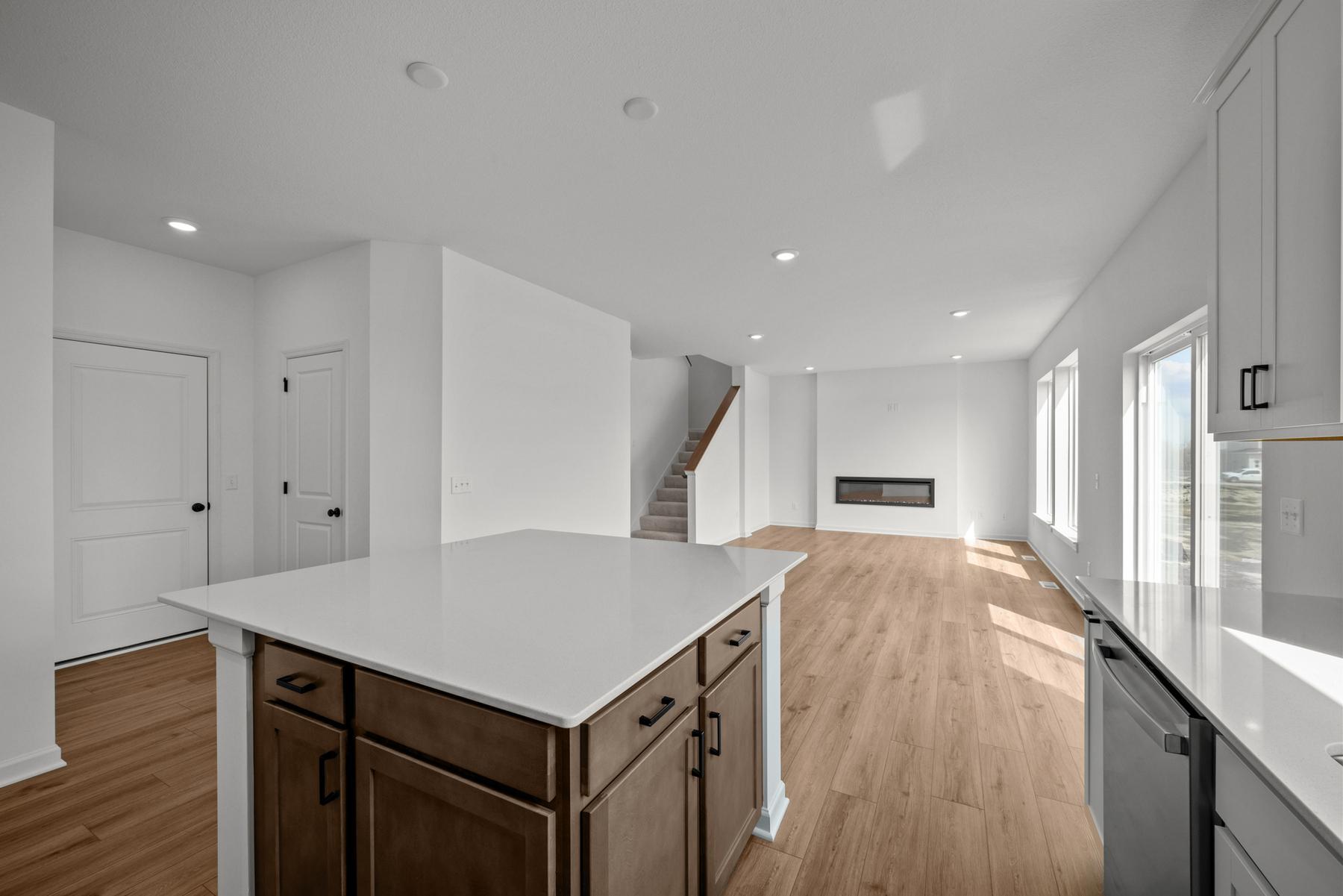 Central kitchen in the McBee plan designed for daily meals and casual gatherings. Images are from a similar home, interior selections may differ